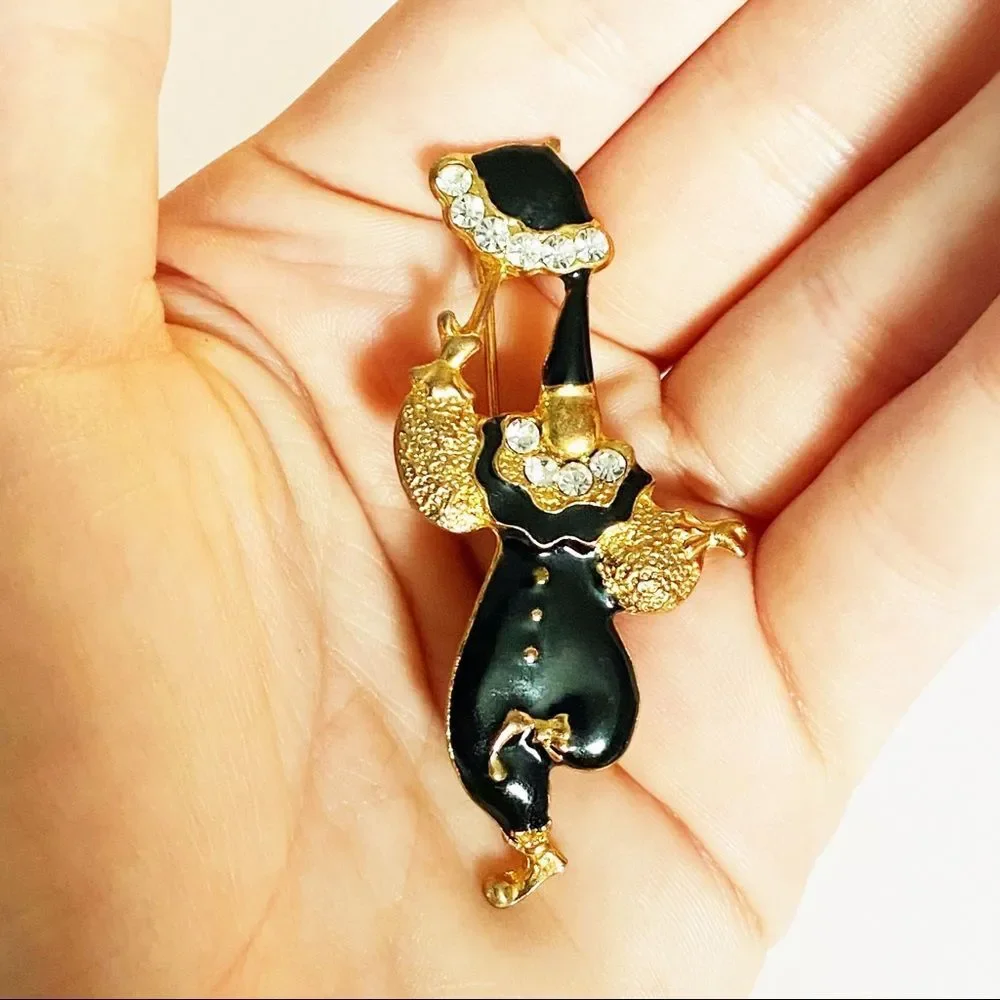 Vintage gold enamel rhinestone clown brooch